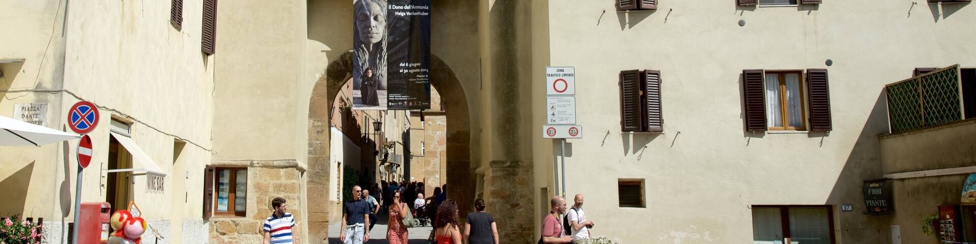Pienza featuring heritage architecture and a small town or village as well as a small group of people