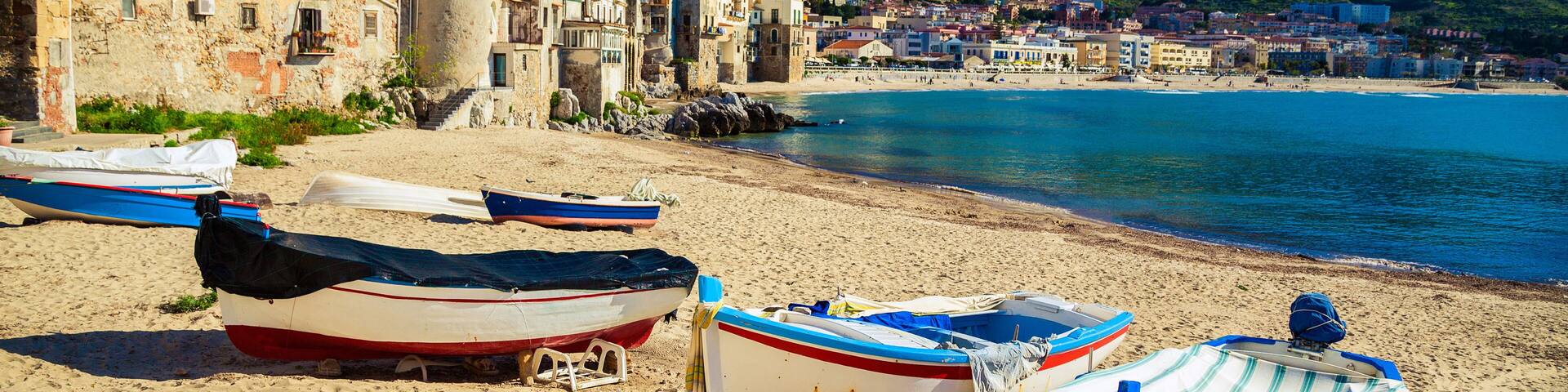Old beach in Cefalu with fishing boats
