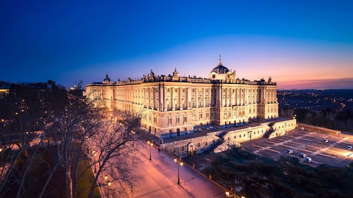 Old stone building in city with sunset sky