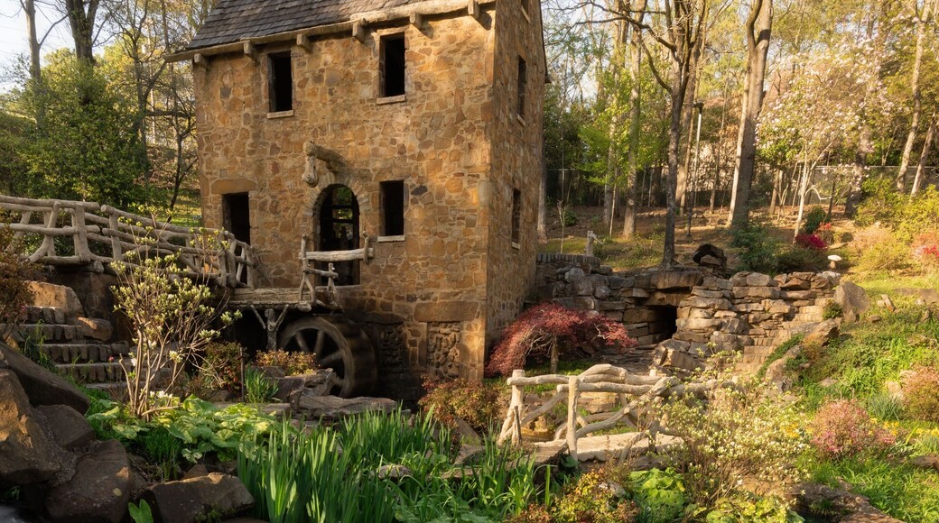 Historical place of Old Mil in Little Rock in Arkansas with flowers and plants near waterfall