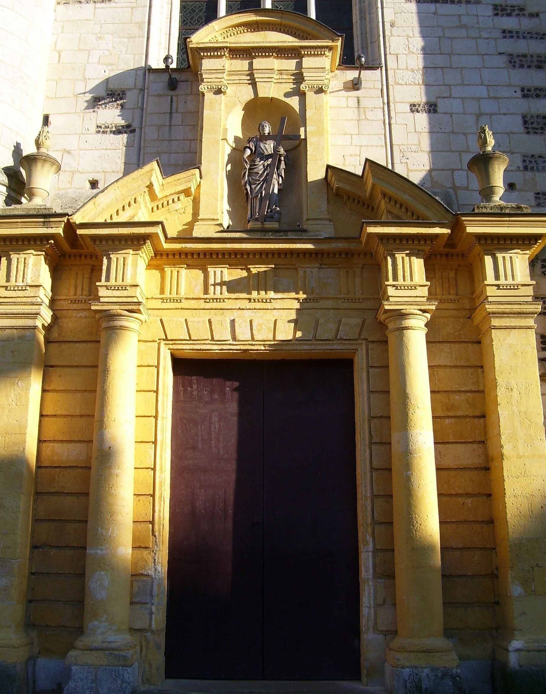 Portal of the church Sainte-Croix in Bernay (Eure, France). The portal was restored not long ago, the strange yellow colour will fade.
