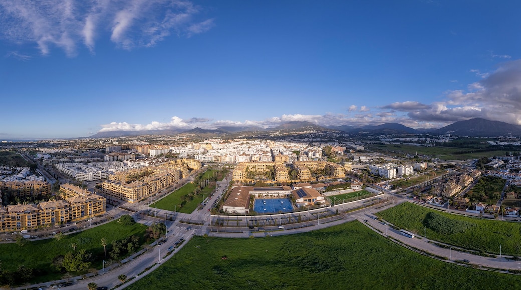 Wide panoramic view of San Pedro de Alcantara in Marbella in afternoon soon against a blue sky