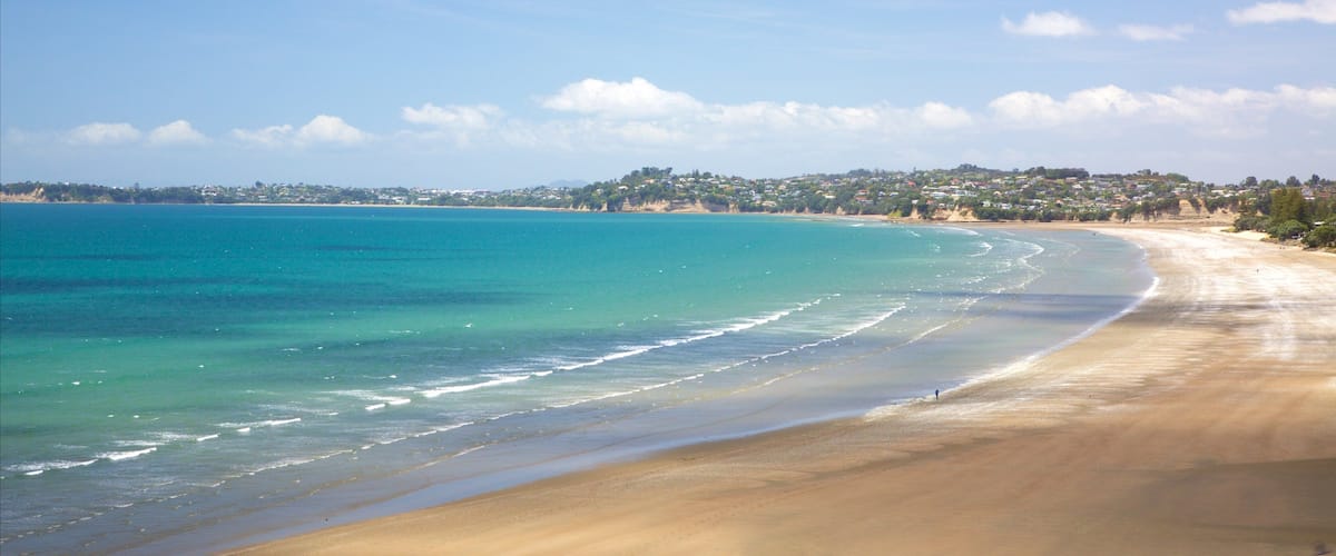 Orewa featuring a bay or harbor and a sandy beach