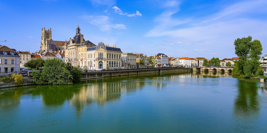 Reflection of Saint Stephen's cathedral overlooking the City Hall of Meaux in the Marne river in the Seine et Marne Department near Paris, France