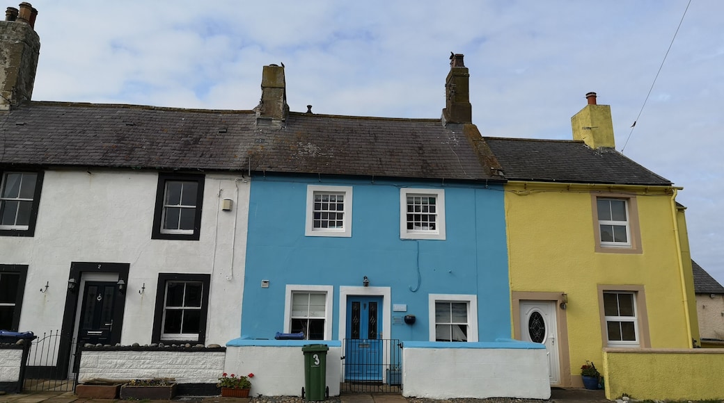 Colourful cottages by the sea in Allonby.