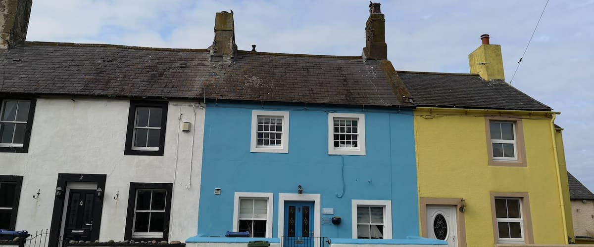 Colourful cottages by the sea in Allonby.