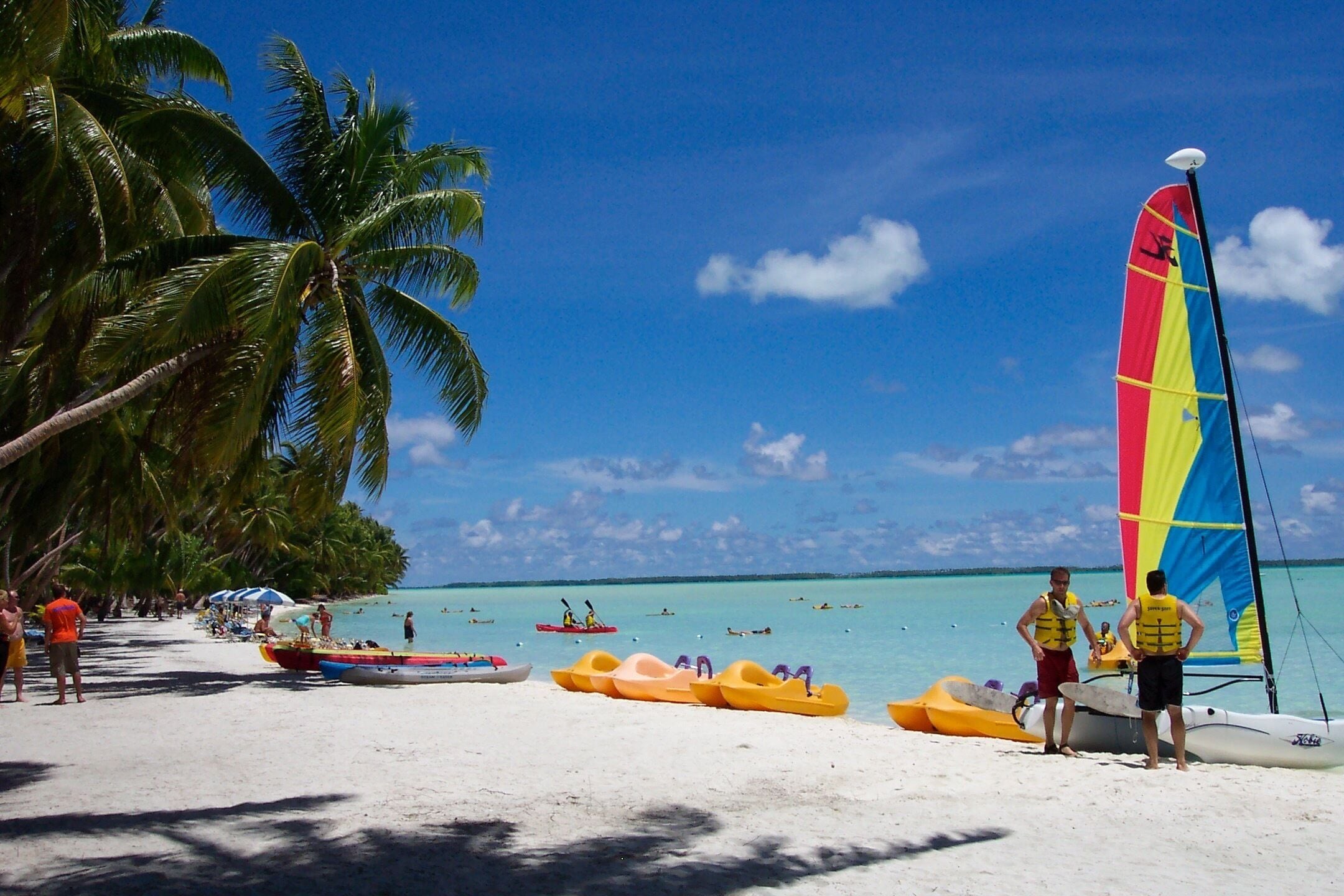 Tabuaeran Kiribati aka Fanning Island. An atoll in the South Pacific.  Waist deep crystal clear water in which you can walk miles out. Population of 2,000, the locals are friendly and make incredible handmade souvenirs.