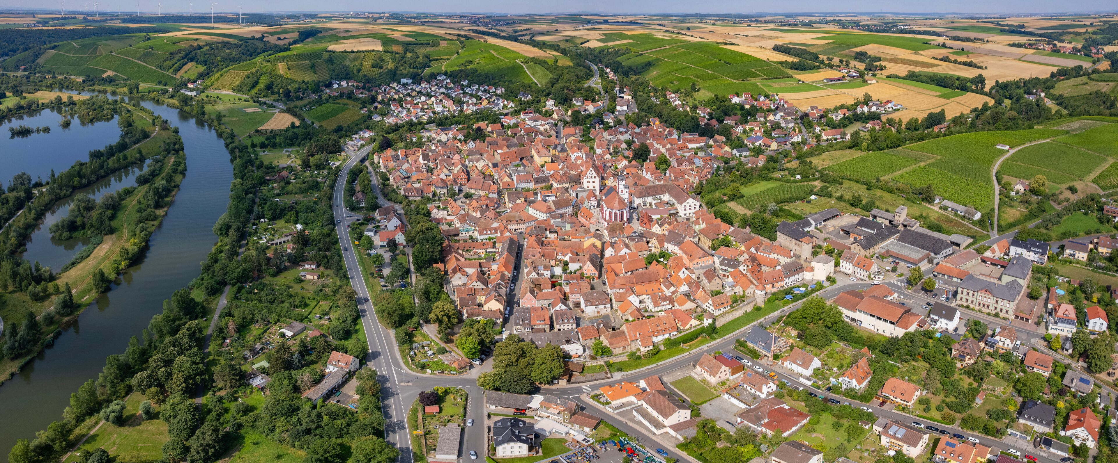 Aerial panorama view around the old town in the city Dettelbach on an sunny spring day in Germany	
