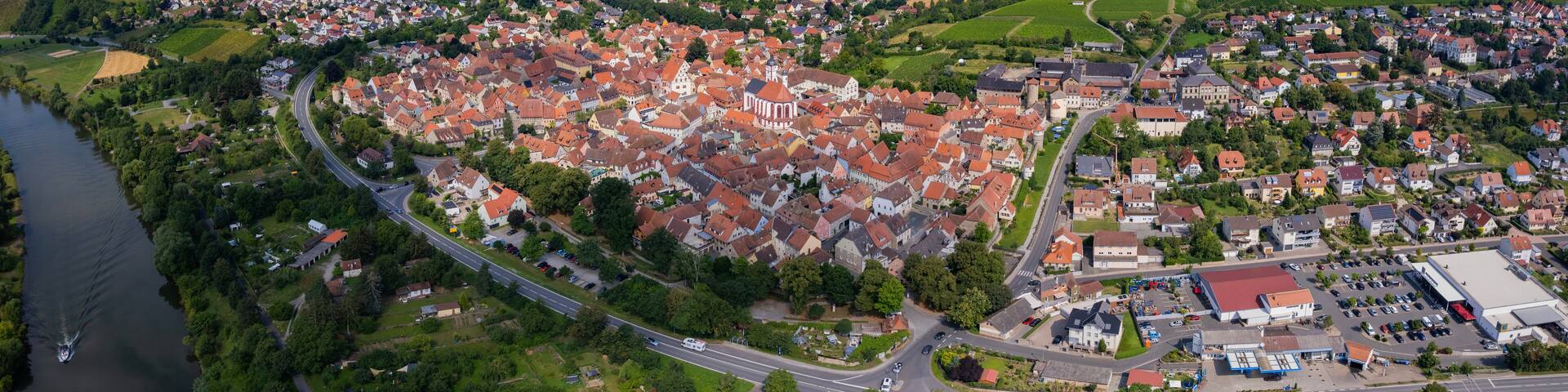 Aerial panorama view around the old town in the city Dettelbach on an sunny spring day in Germany