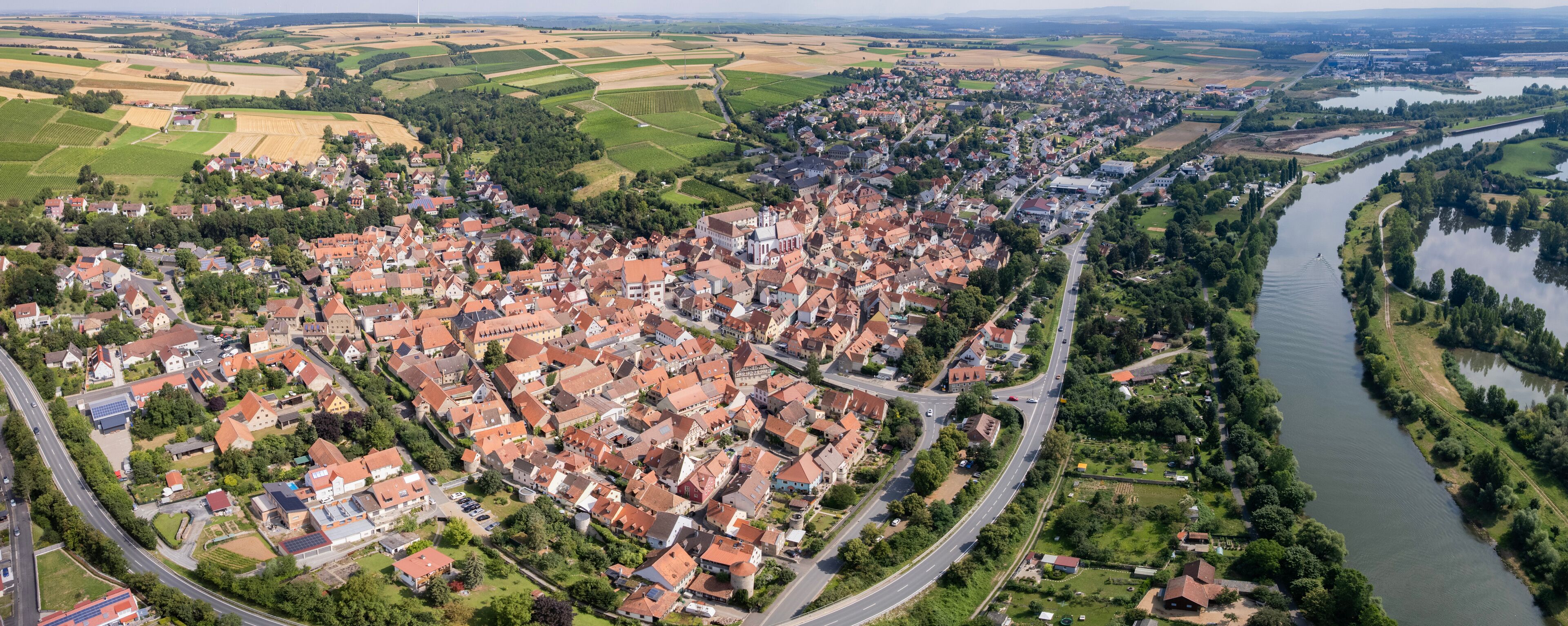 Aerial panorama view around the old town in the city Dettelbach on an sunny spring day in Germany	
