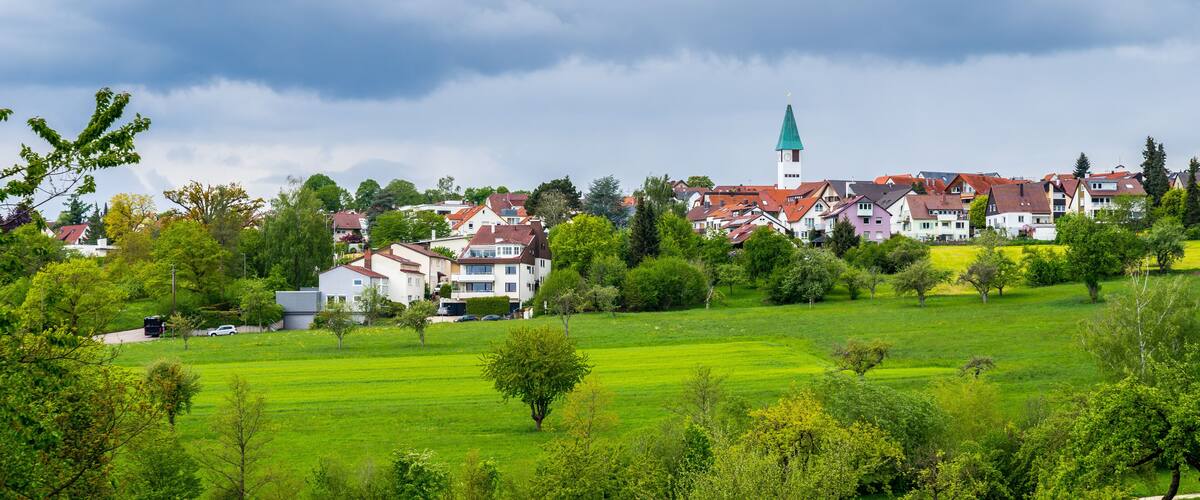 Germany, Dreamy town ostfildern kemant behind green nature countryside in spring