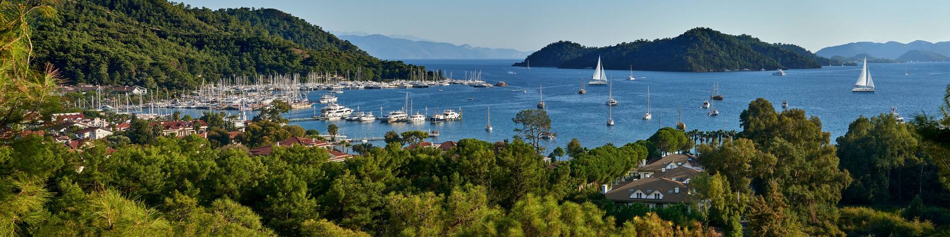 Panoramic view of bay and city of Gocek - Fethiye, Turkey with marina and yachts.