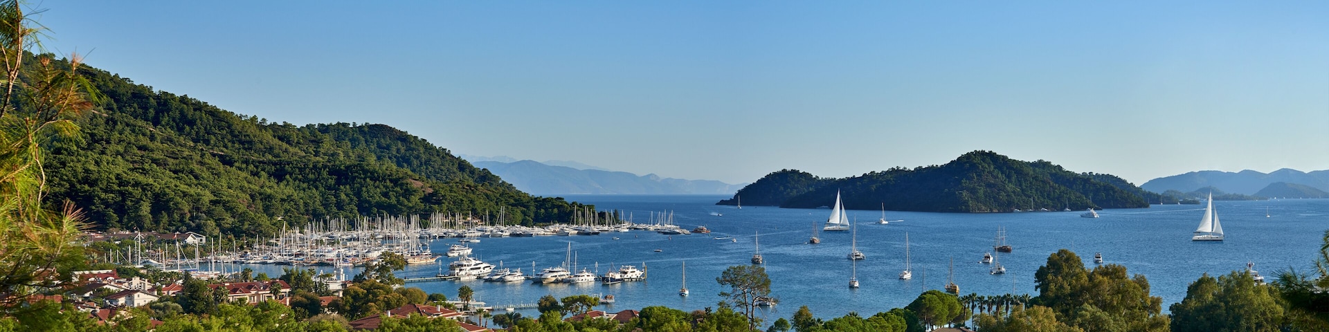 Panoramic view of bay and city of Gocek - Fethiye, Turkey with marina and yachts.