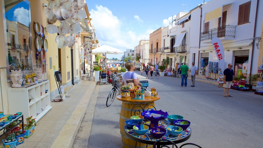 San Vito Lo Capo featuring markets and street scenes as well as a small group of people
