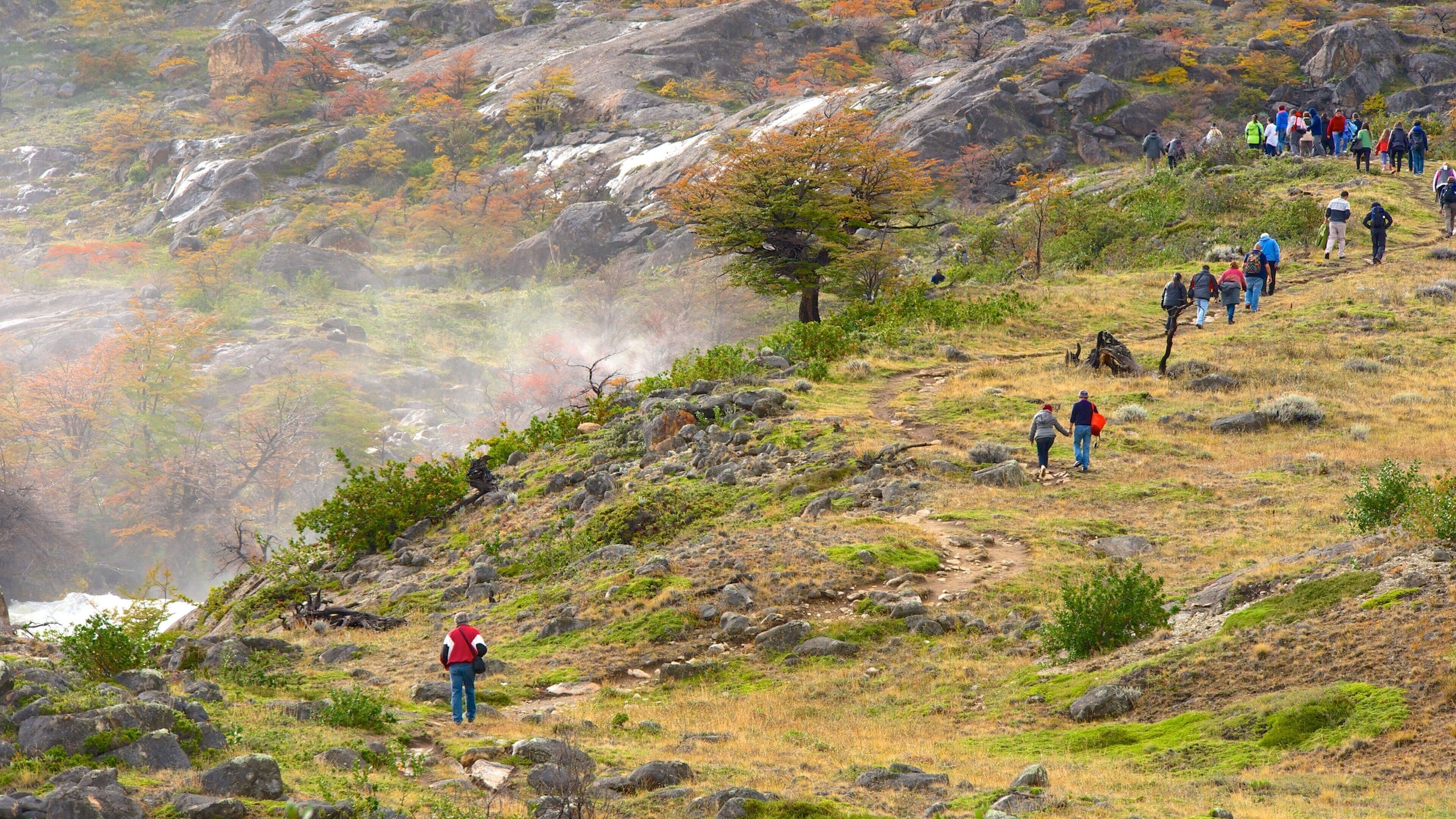 El Calafate which includes hiking or walking and tranquil scenes as well as a large group of people