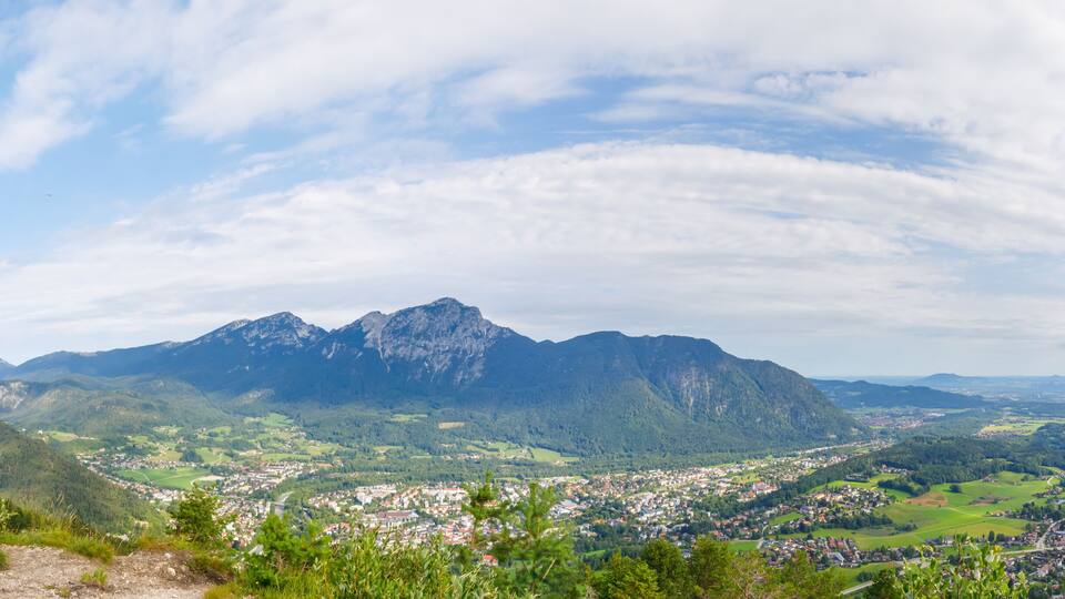 A mountainous landscape with a town nestled in the valley.