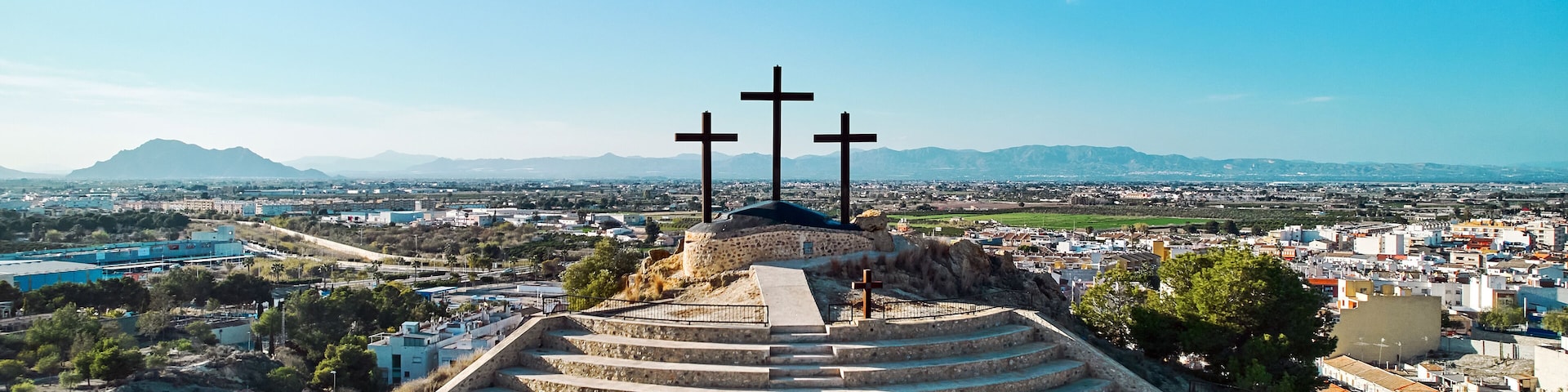 Monte Calvario and three crosses against blue sky view