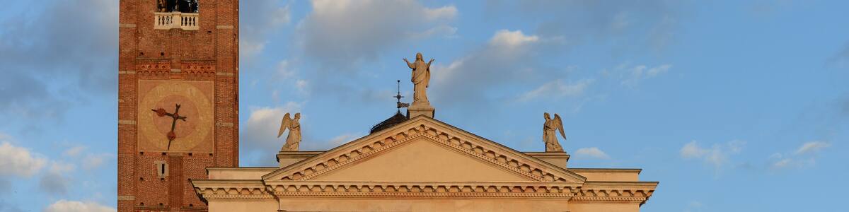 church of santa maria assunta with bell tower in the autumn evening sun in Gallarate, Varese, Italy