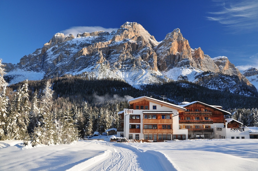 Chalets and mountain houses in the middle of the snow high in the italian Dolomites