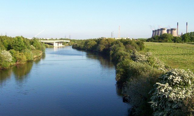 Work In Progress Taken from the railway bridge near Fairburn Ings. This shot looks South Easterly, downstream and shows the on going construction work on the new A1/M1 motorway bridge.