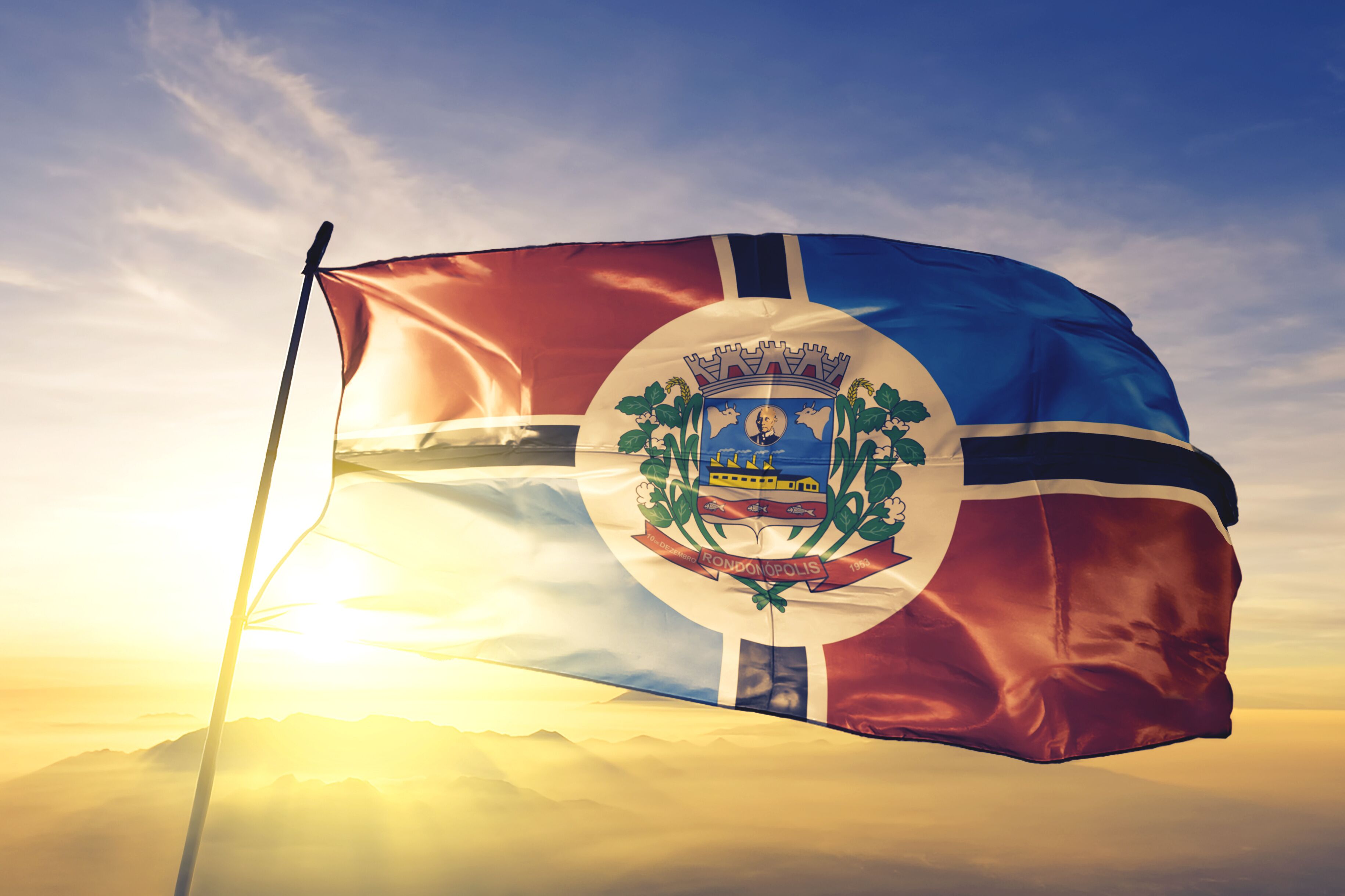 Rondonopolis of Brazil flag waving on the top sunrise mist fog