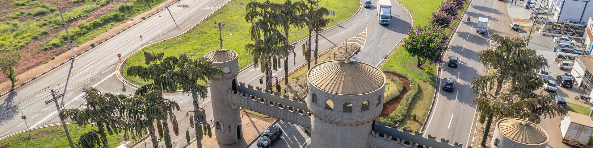 Paulinia, Sao Paulo, Brazil. October 25 2022: Portal of the city of Paulínia in the interior of São Paulo. Cars, city entrance and castle style portal.