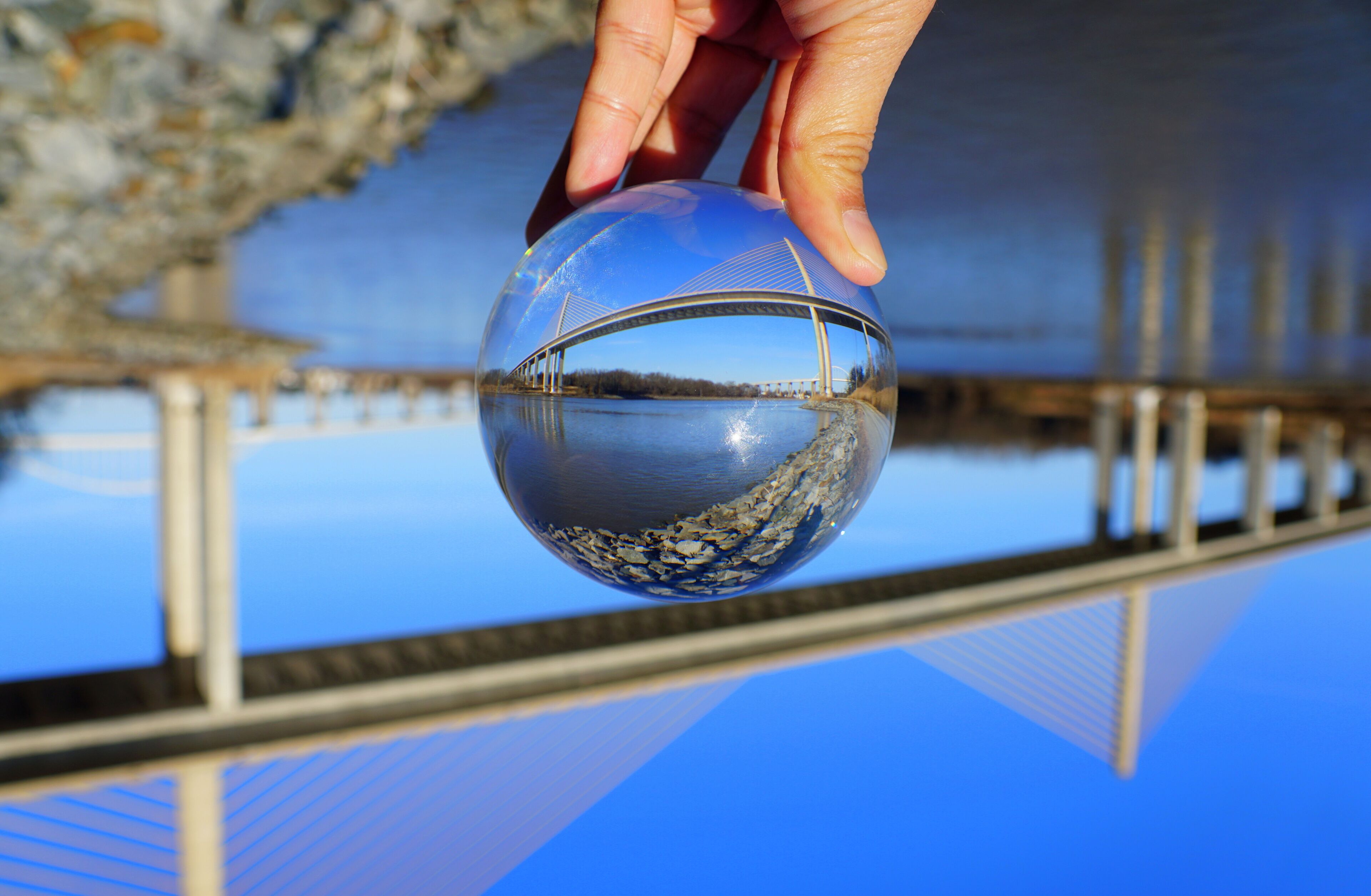 The view of William V Roth Bridge captured through a crystal lens ball near Middletown, Delaware, U.S