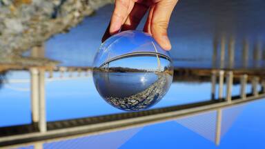 The view of William V Roth Bridge captured through a crystal lens ball near Middletown, Delaware, U.S