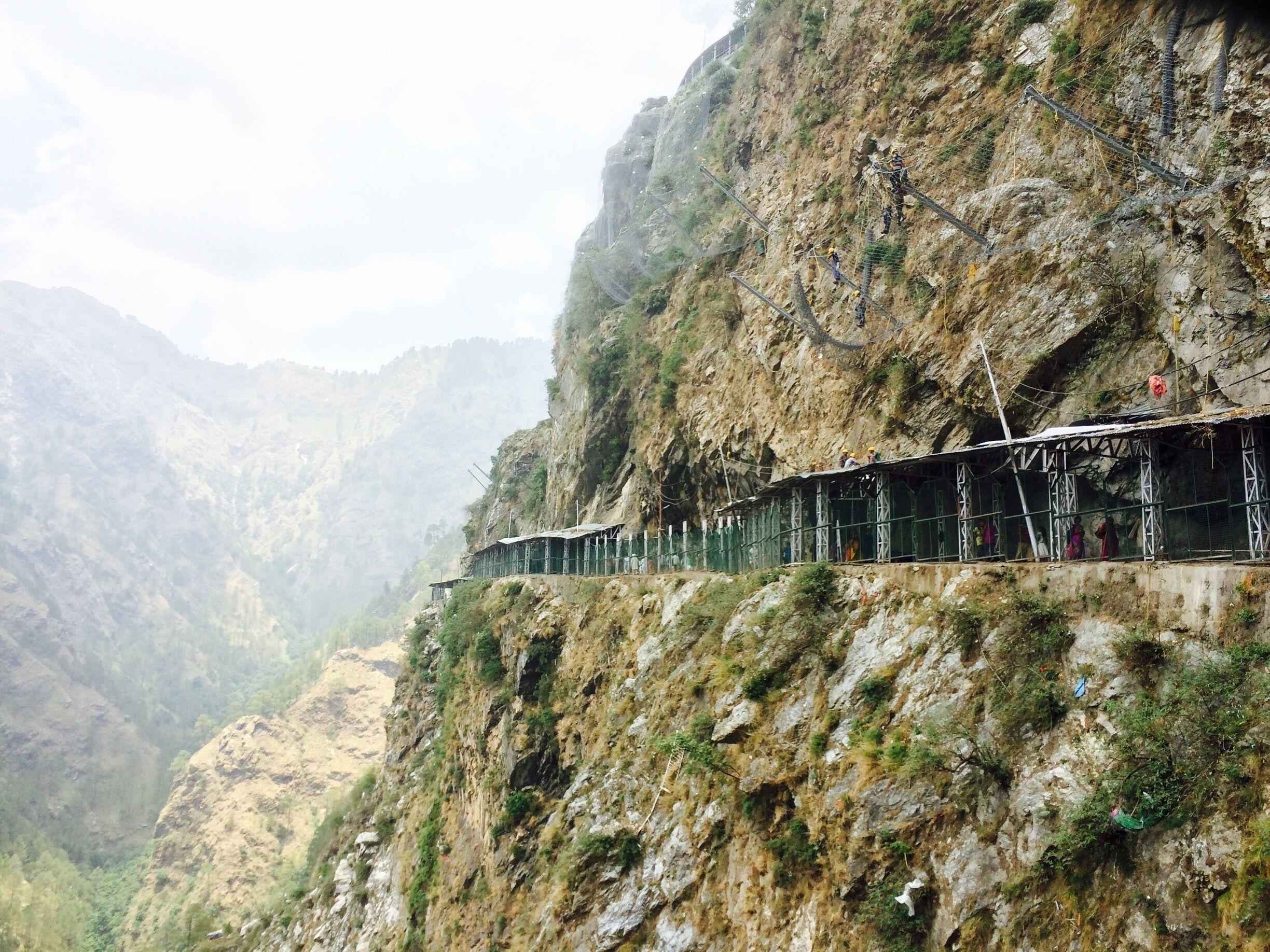 A train track on a steep mountain cliff.