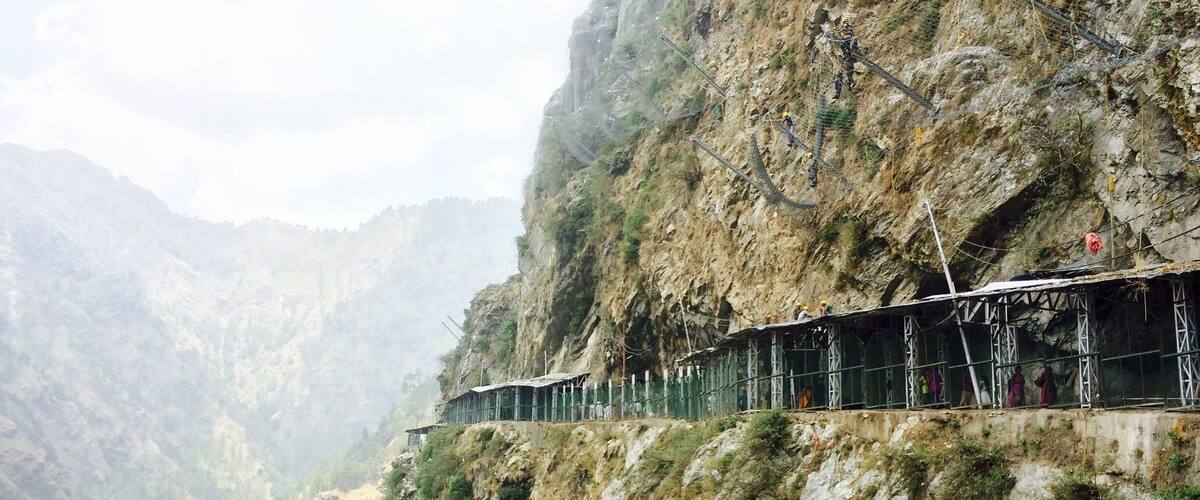 A train track on a steep mountain cliff.