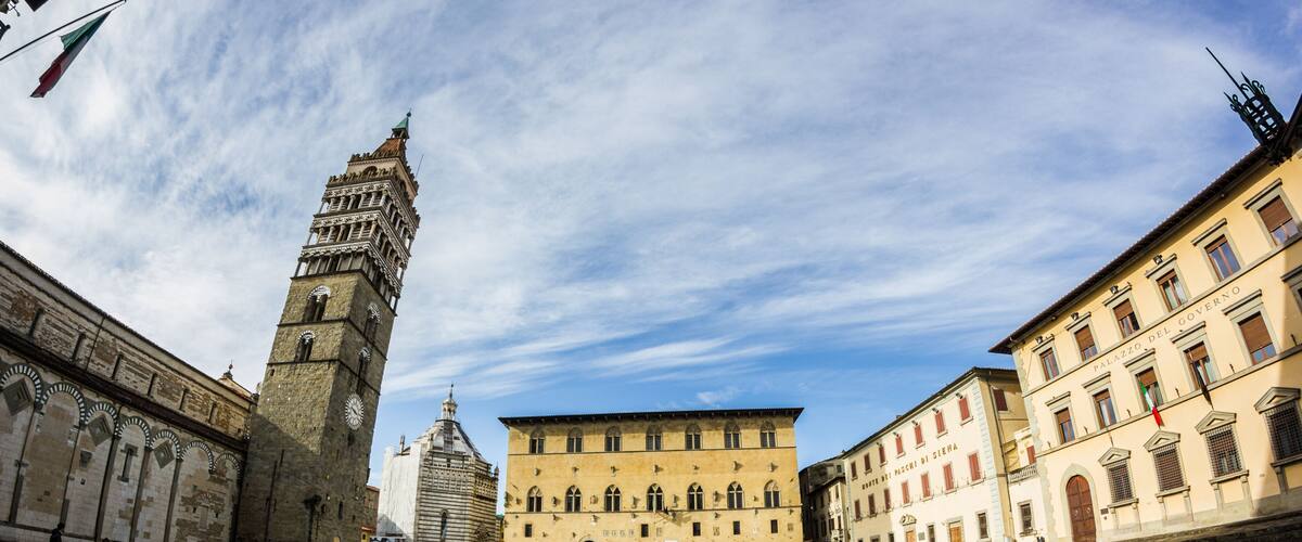 A historic square with a prominent tower, a large building labeled 'Palazzo del Governo,' and a clear blue sky.