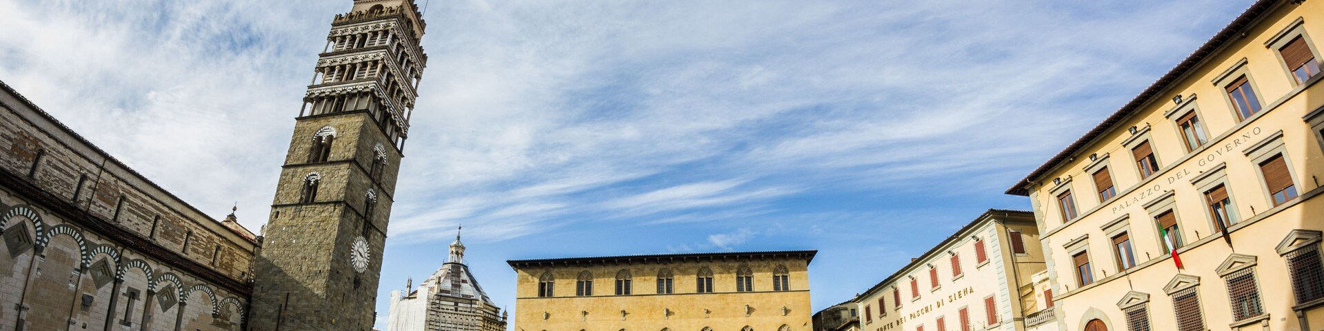 A historic square with a prominent tower, a large building labeled 'Palazzo del Governo,' and a clear blue sky.