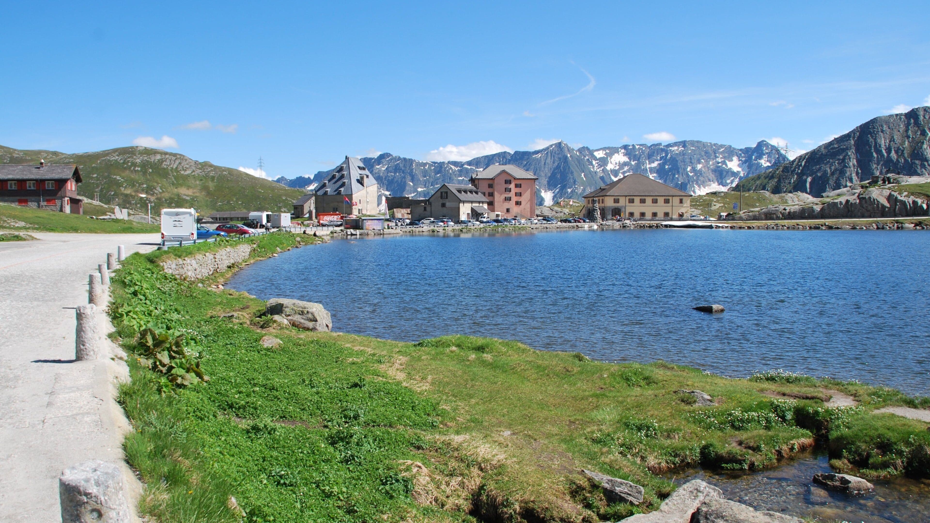 Andermatt featuring a lake or waterhole and a small town or village