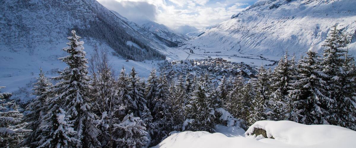 Andermatt showing snow, a sunset and landscape views