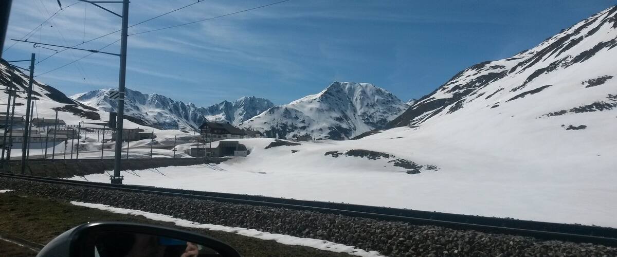 A snow-covered mountain range with a clear sky.
