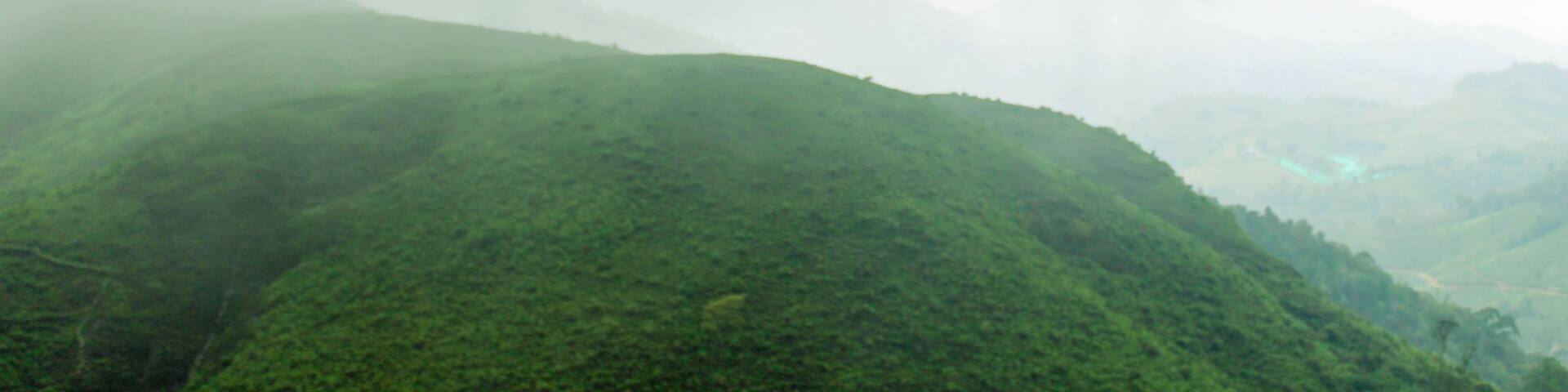 Mountain landscape with fog Beautiful view of Parunthumpara mountains Idukki, Kerala, India