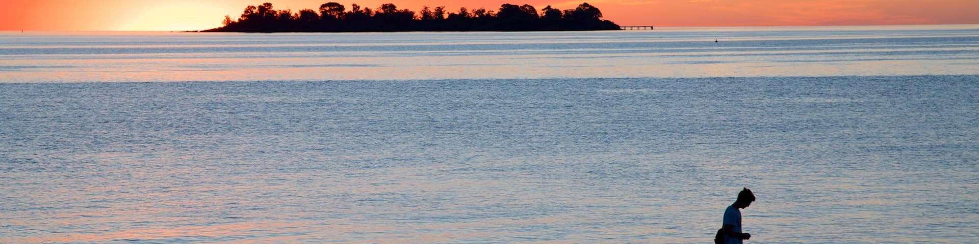 Colonia del Sacramento which includes a sunset and general coastal views