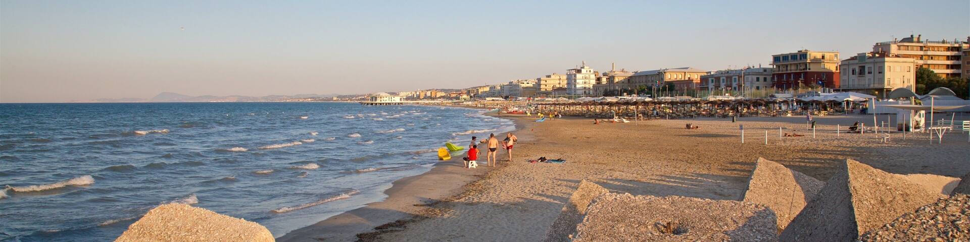 Senigallia showing a coastal town, a sunset and general coastal views