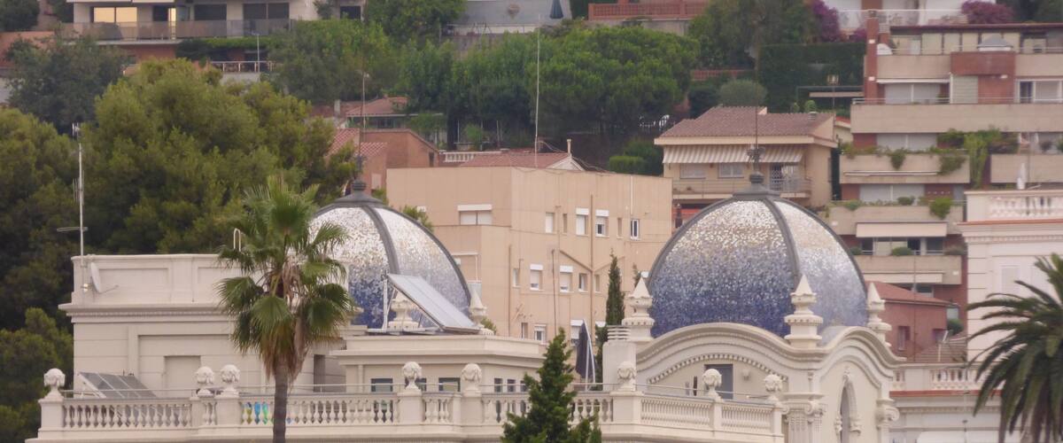 A building with two large domes and a white facade.