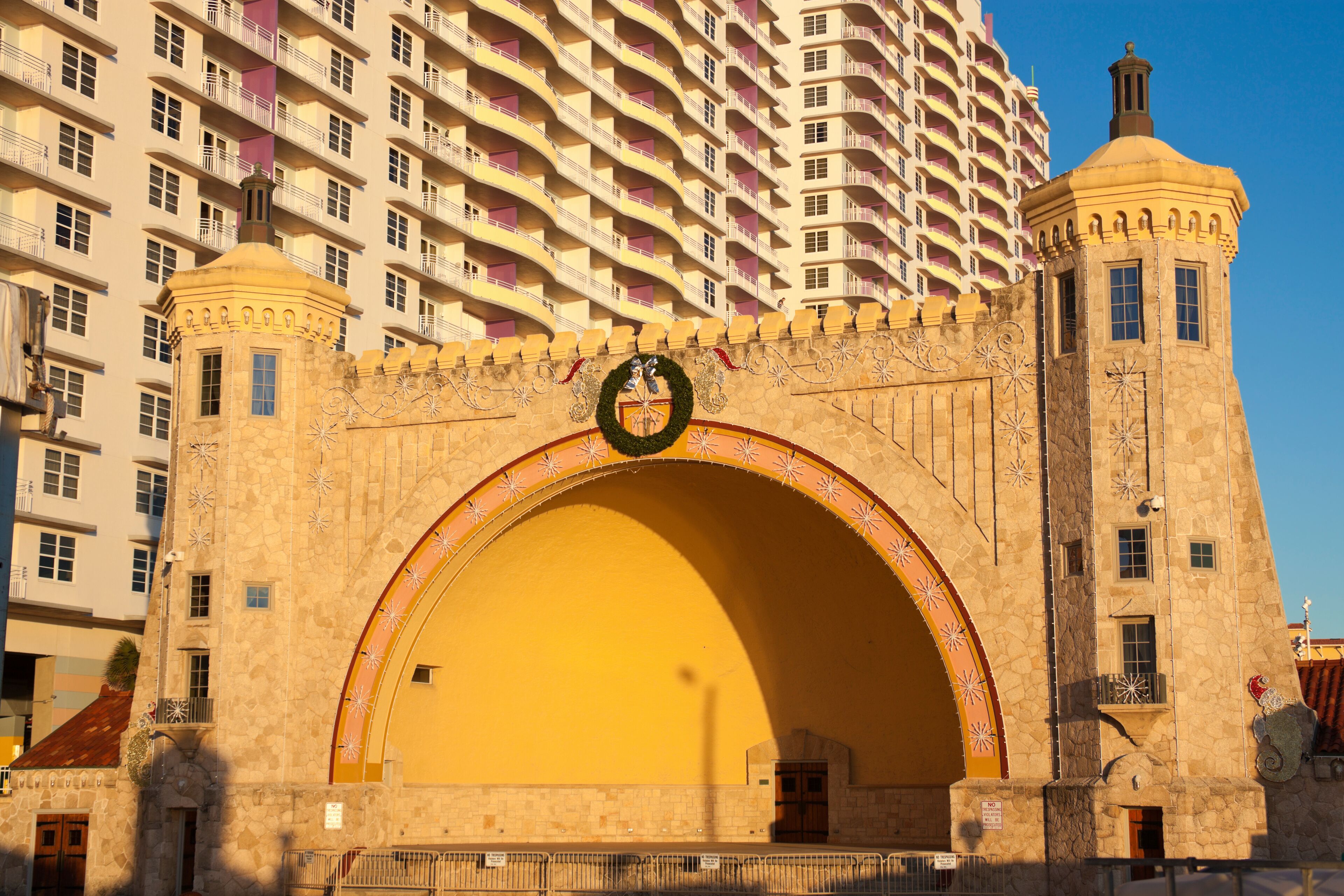 A historic building with a large archway, a clock, and a tower.
