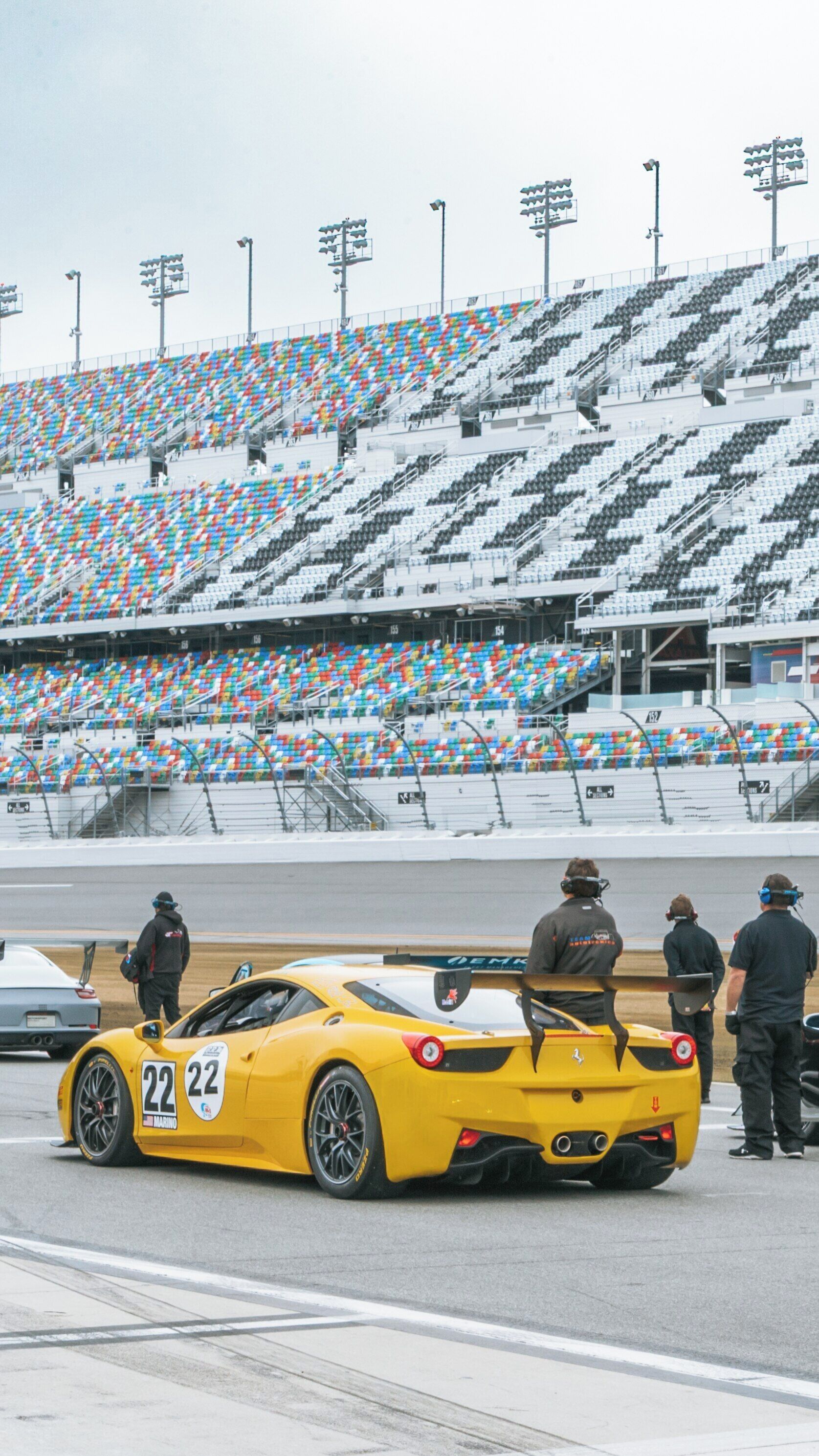Exciting racing activity at Daytona International Speedway in Daytona Beach, Florida featuring a yellow race car