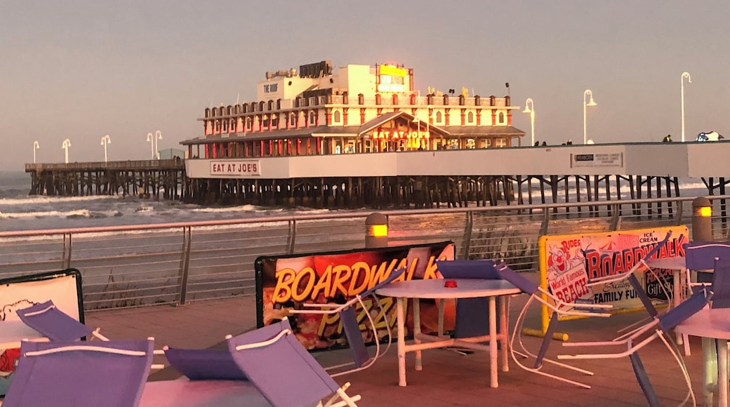 Sunset at Daytona Beach. Some cool stone memorials of the early Daytona Beach Racetrack and the drivers who had records from 1906 to 1954 are along the ocean side of promenade in front of the Hilton to the pier.