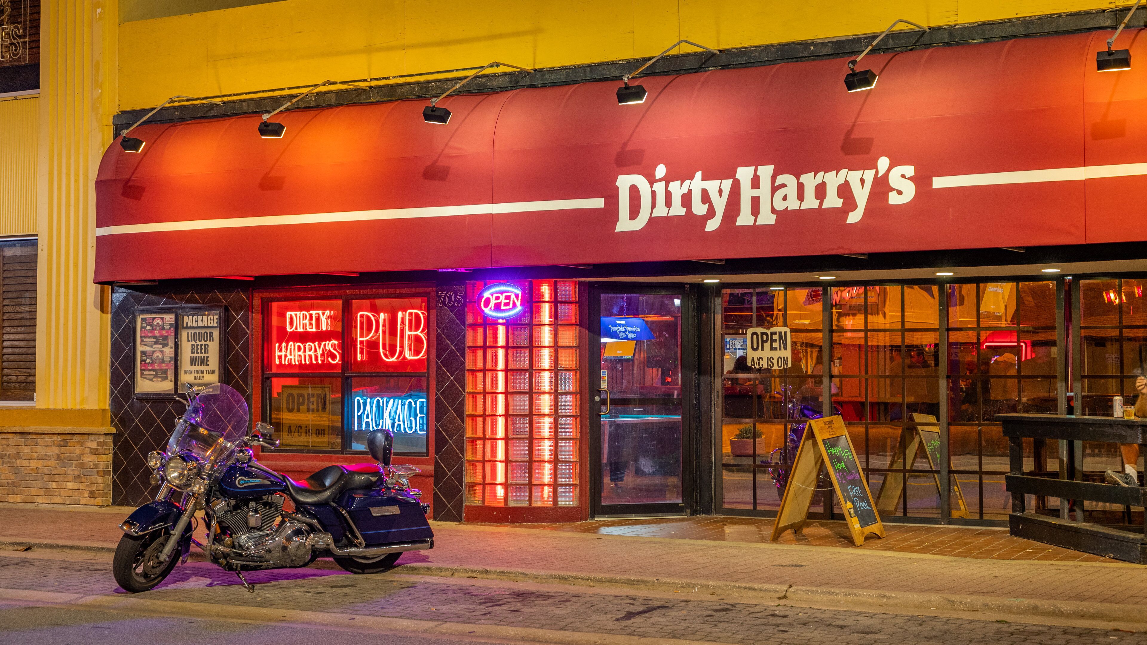 Daytona Beach featuring signage and a bar