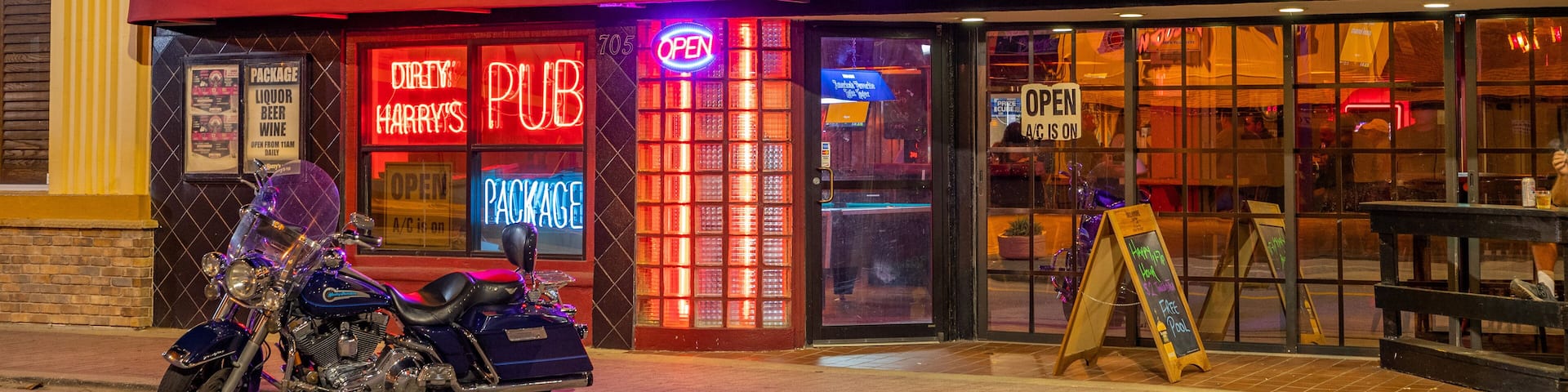 Daytona Beach featuring signage and a bar
