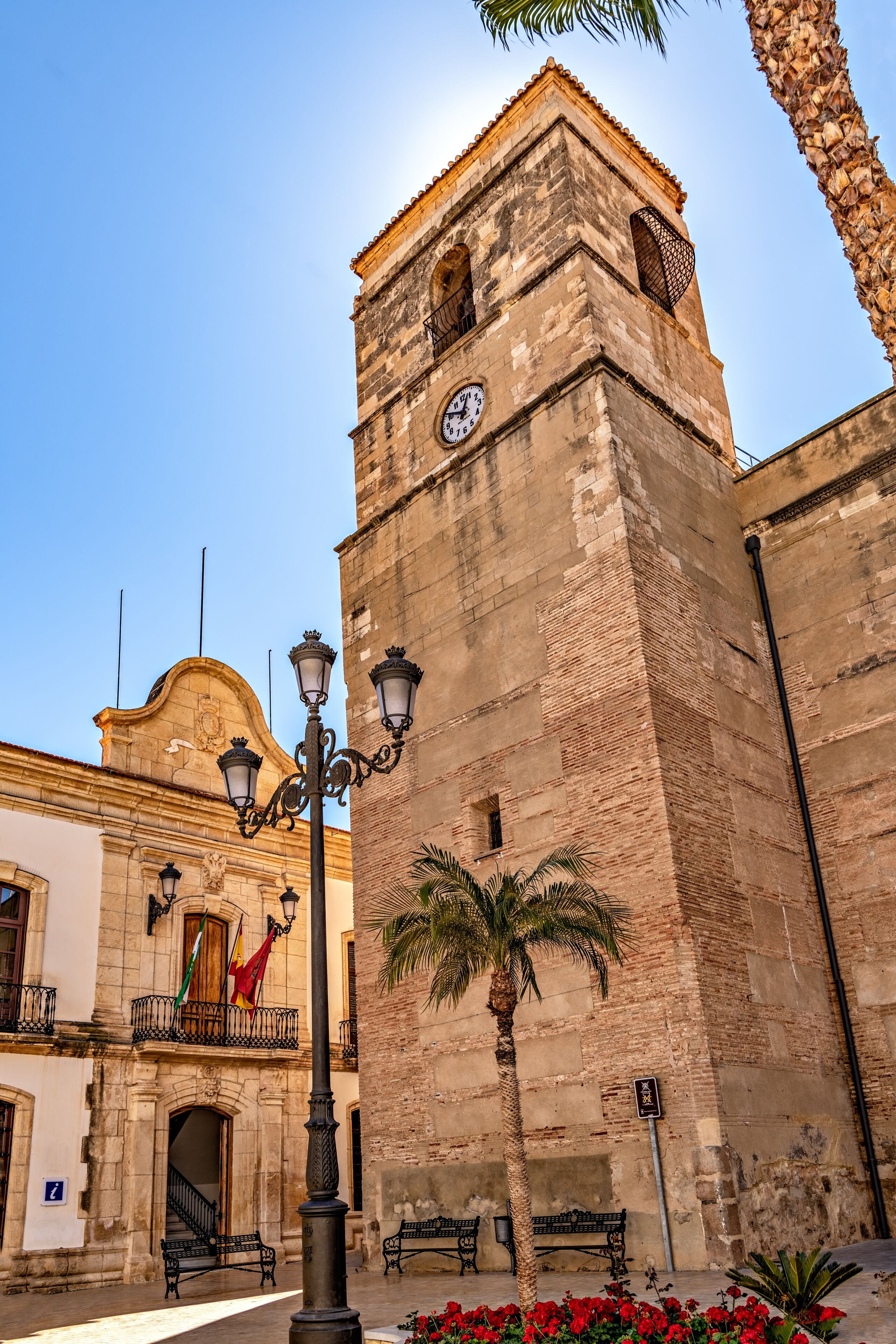 View of church tower and town hall building in the Mediterranean town of Vera, Spain.
