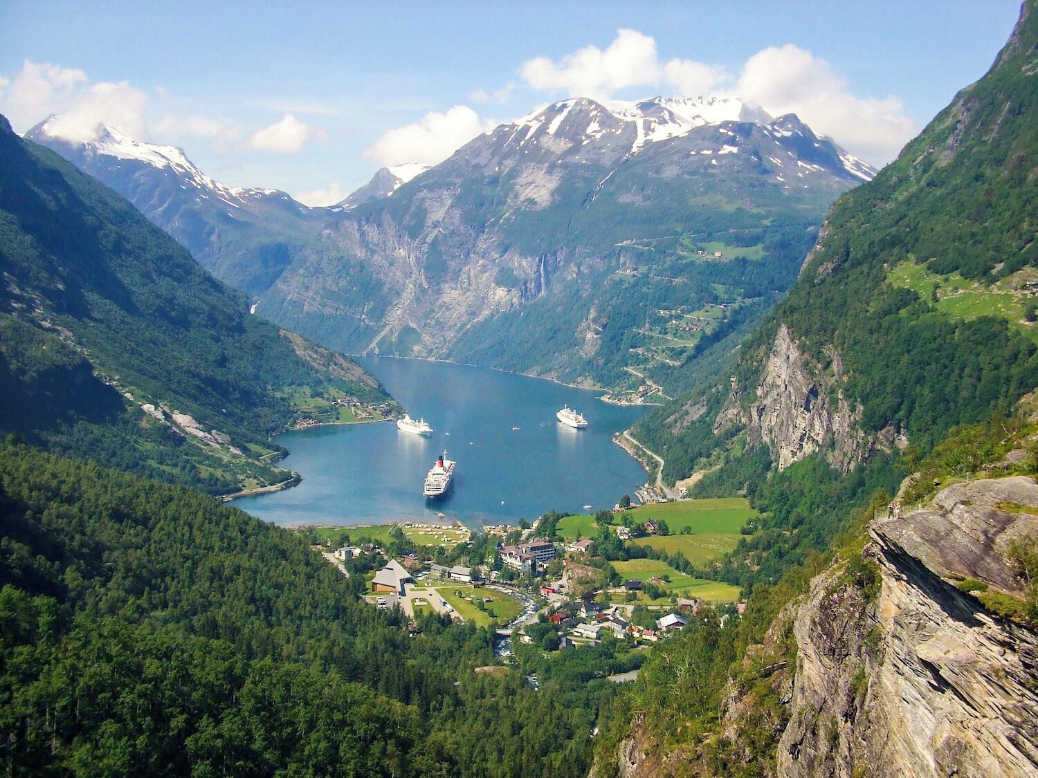 With impressive #green mountains, valleys and forests surrounding the head of the Sunnylvsfjorden in Norway, any vantage point above the village of Hellesylt below offers a breathtaking view in every direction.