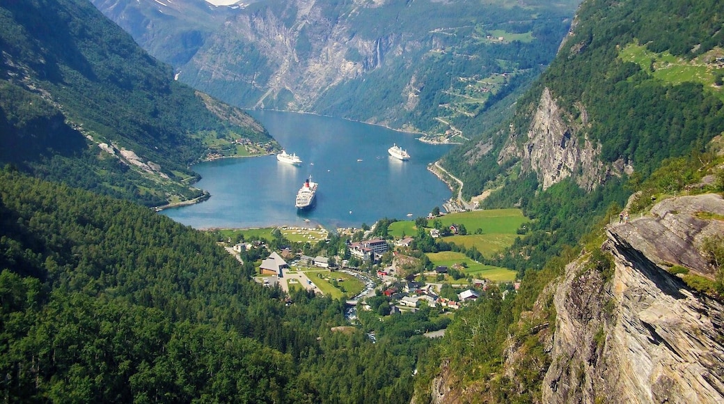 With impressive #green mountains, valleys and forests surrounding the head of the Sunnylvsfjorden in Norway, any vantage point above the village of Hellesylt below offers a breathtaking view in every direction.