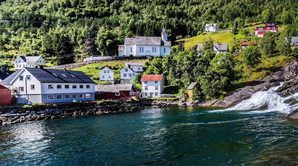NORWAY: Hellesylt village and waterfall Geirangerfjord in Norway
