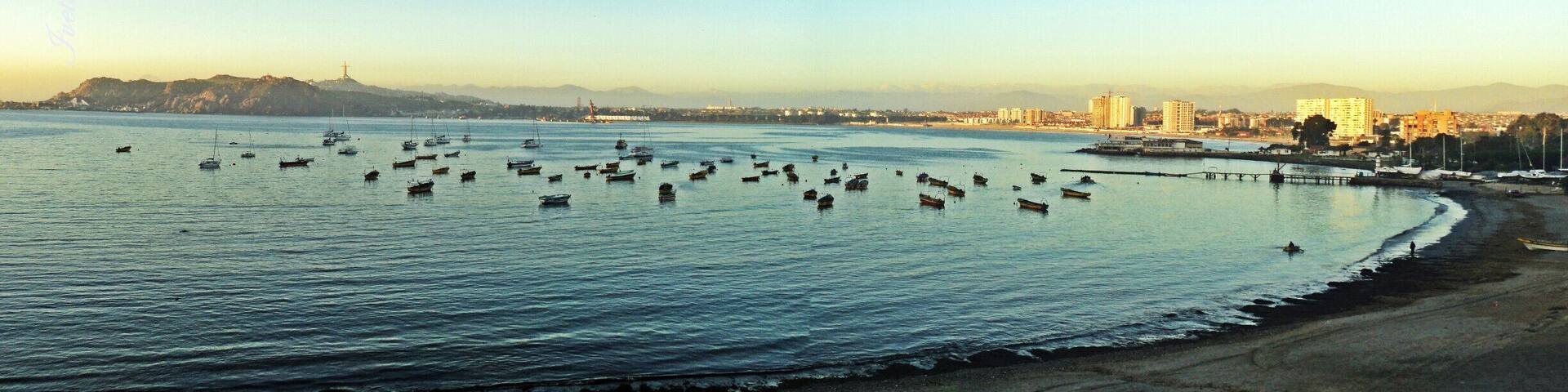 Beach with calm waters.