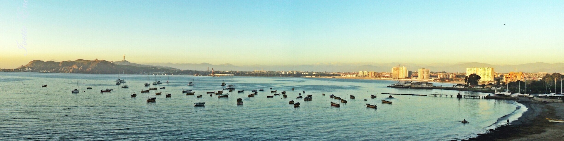 Beach with calm waters.